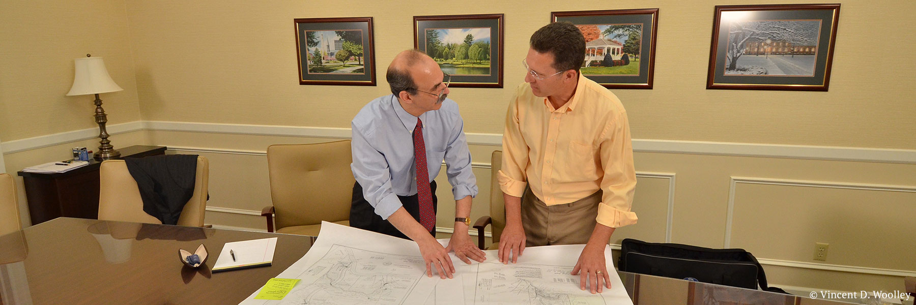 Warren County, New York lawyer Neil Lebowitz in a mock meeting with a client discussing a real estate site plan. Photographer: Vincent D. Woolley. Copyright owner-licensor: Vincent D. Woolley. Copyright licensee: Neil H. Lebowitz.